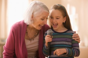 Grandmother and granddaughter with microphone