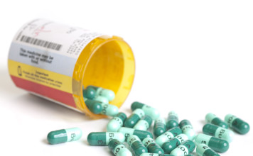 Antibiotic prescription container open.