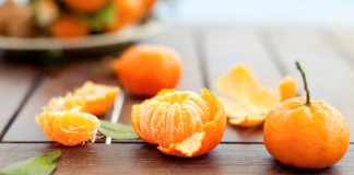 Fresh tangerines on a wooden table