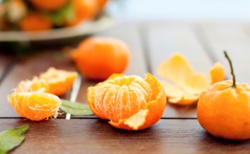 Fresh tangerines on a wooden table