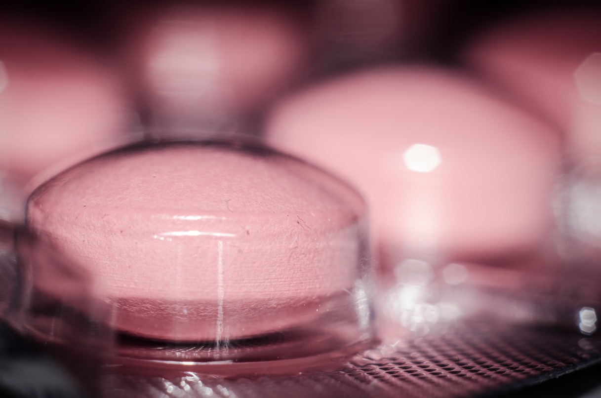 close-up of pink tablets in bubble pack.