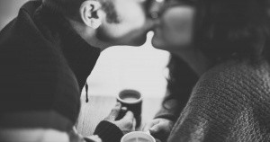 black and white man and woman kissing