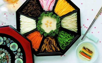relish tray with assorted Julienned vegetables and chopsticks