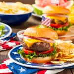 56709921 – homemade memorial day hamburger picnic with chips and fruit