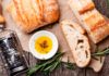 Sliced bread Ciabatta and extra virgin Olive oil on wooden background