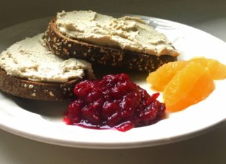 vegan cream cheese on toast with a side of home made jam and orange Supremes