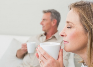 Drinking Tea Cuts Your Risk of Dementia in Half man and woman drinking tea